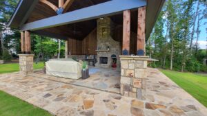 outdoor living area with outdoor kitchen backyard hardscape ideas for landscape design in Atlanta