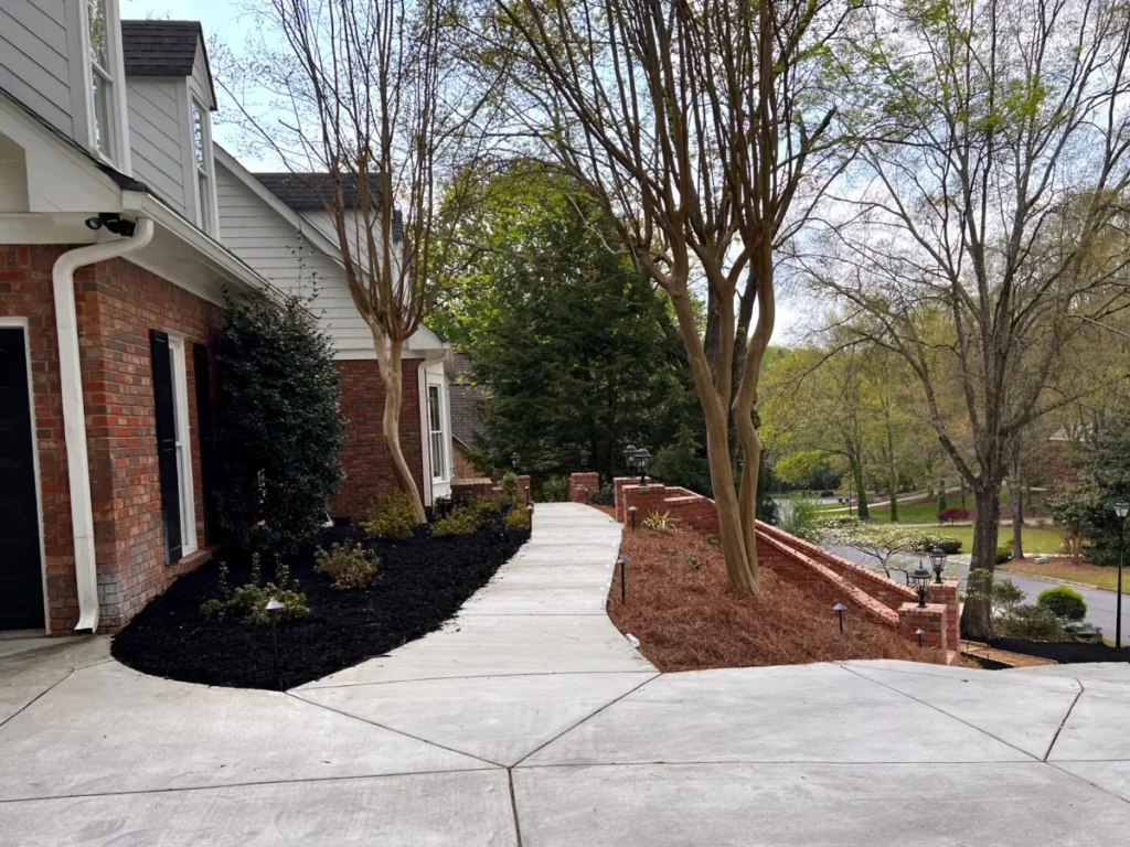 Well designed concrete driveway with patio and brick stair Atlanta Georgia