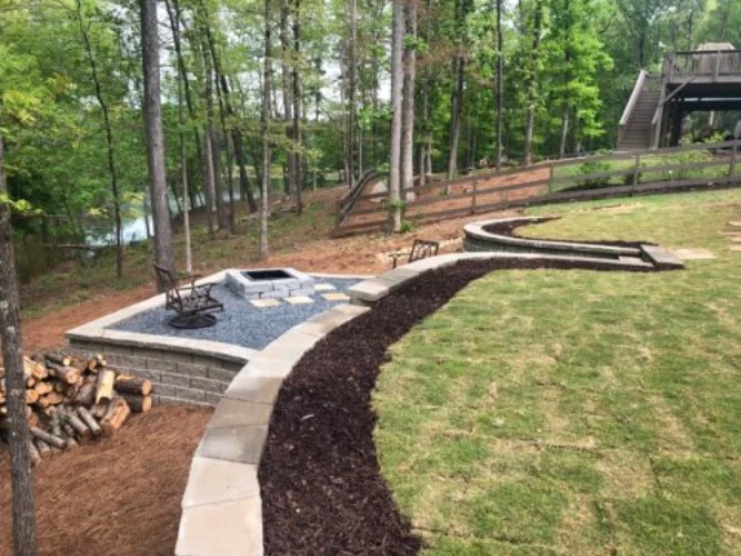 The Ricks Group retaining wall contractor Alpharetta GA with landscaped sloping property