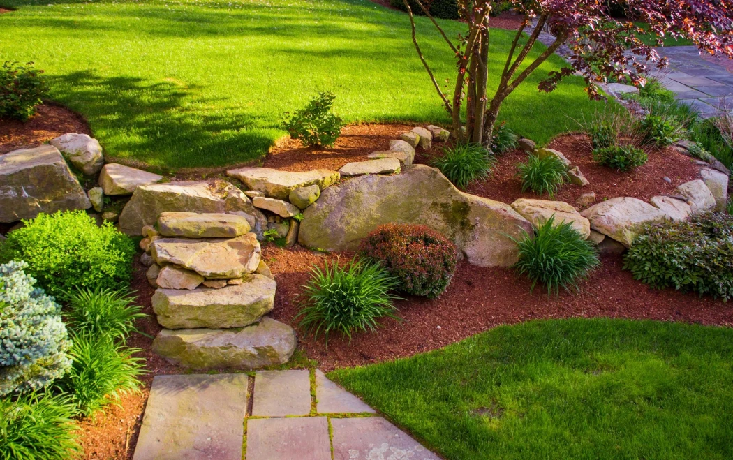 Beautiful Garden and rock wall | Fall Lawn Care Tips in Fulton County