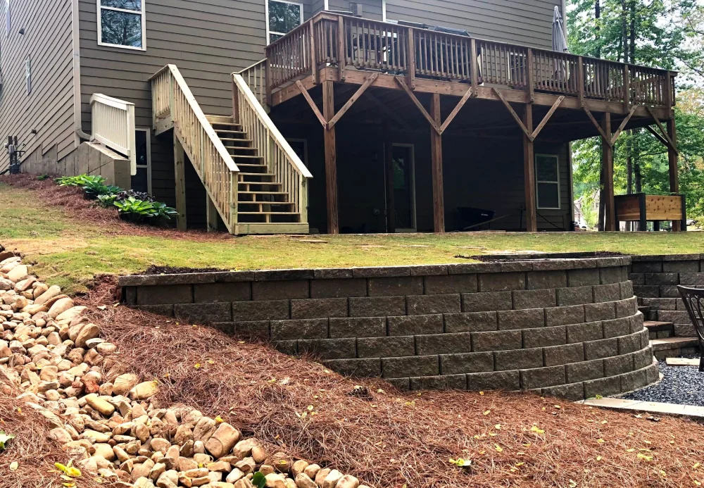 Drainage solutions in Atlanta include retaining walls, native vegetation and dry creek beds