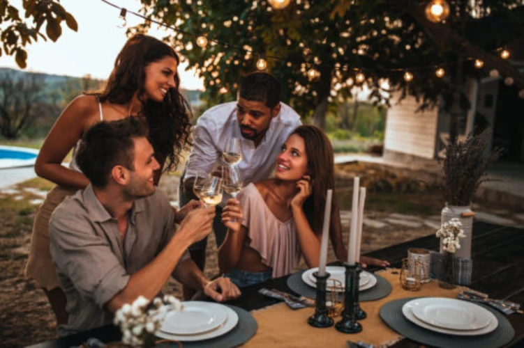 Sandy Springs GA friends enjoying a dinner party in the outdoor living area